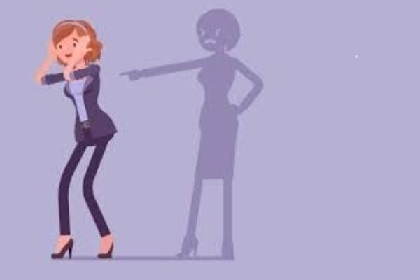 Illustration of a woman facing a critical shadow